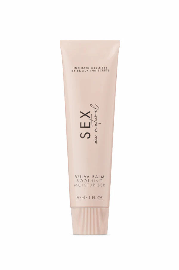 Vulva balm and gentle intimate care products arranged on a soft neutral surface